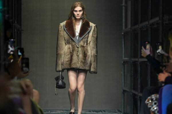 Prada reconstructs femininity starting with the small black dress for a global "black moment"
