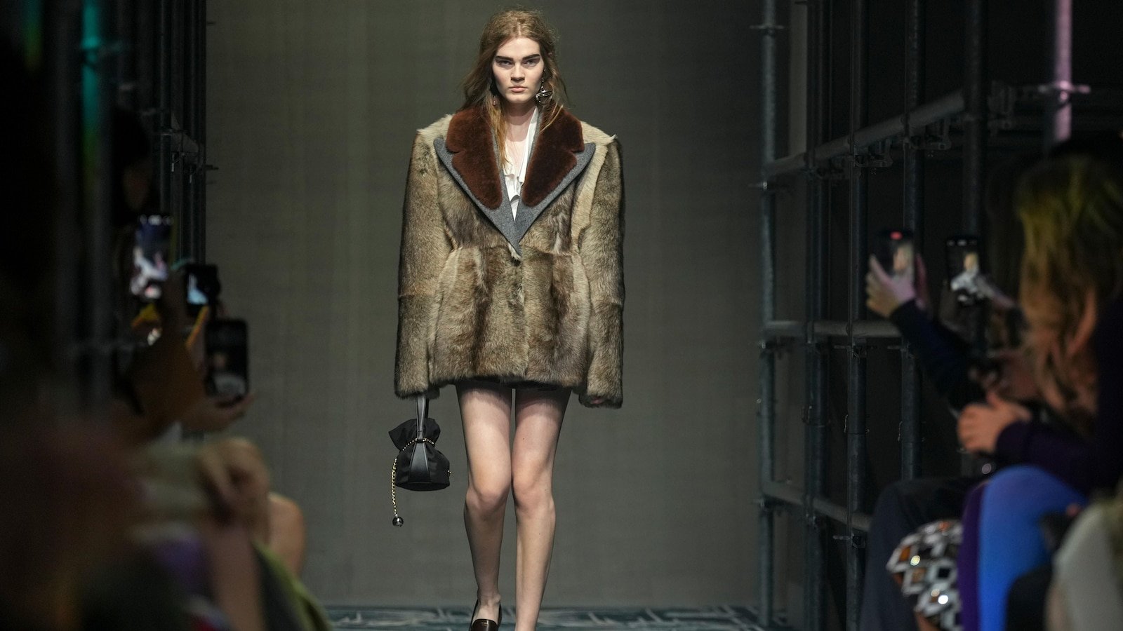 Prada reconstructs femininity starting with the small black dress for a global "black moment"