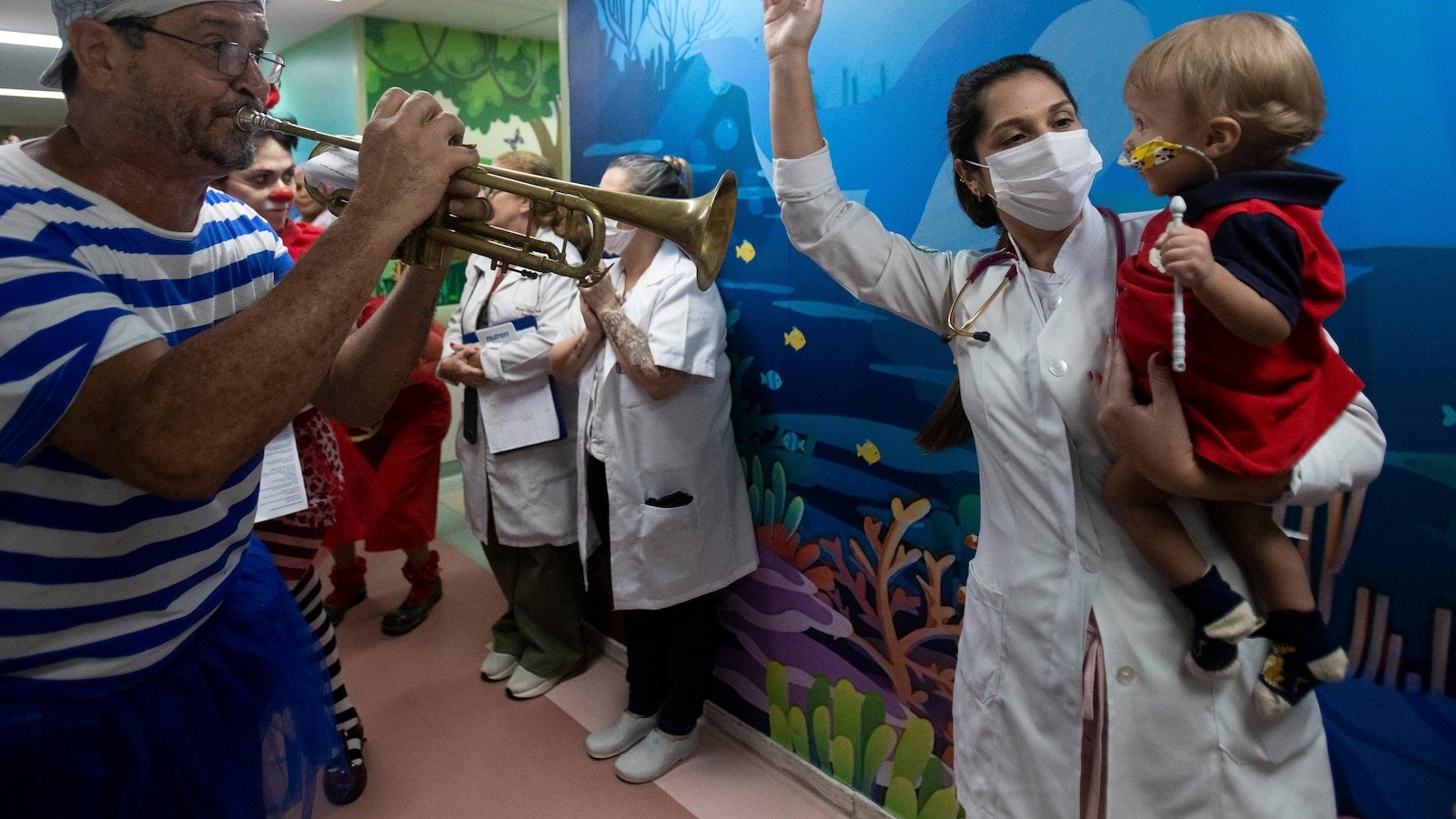Clowns and musicians bring the joy of the carnival to sick children in a river hospital