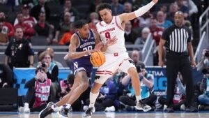 Nolan Winter and John Tonje Leadra No. 18 Wisconsin on Northwest 70-63