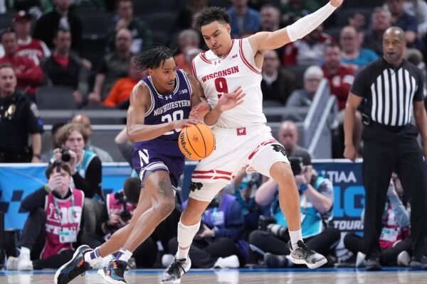 Nolan Winter and John Tonje Leadra No. 18 Wisconsin on Northwest 70-63