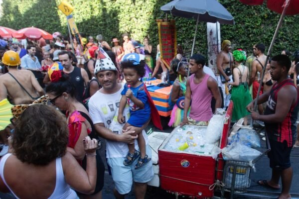 Street vendors dispens the fuel for the river carnival party, but the reference face