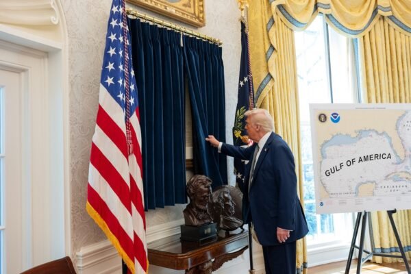 Trump hangs a copy of the declaration of independence in the Oval office