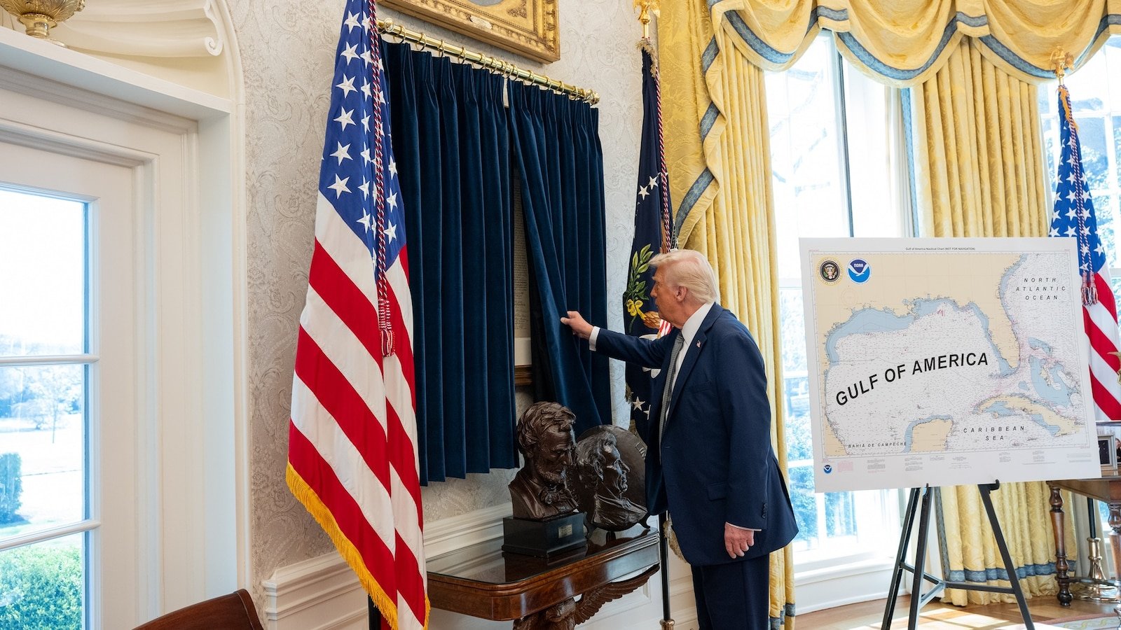 Trump hangs a copy of the declaration of independence in the Oval office