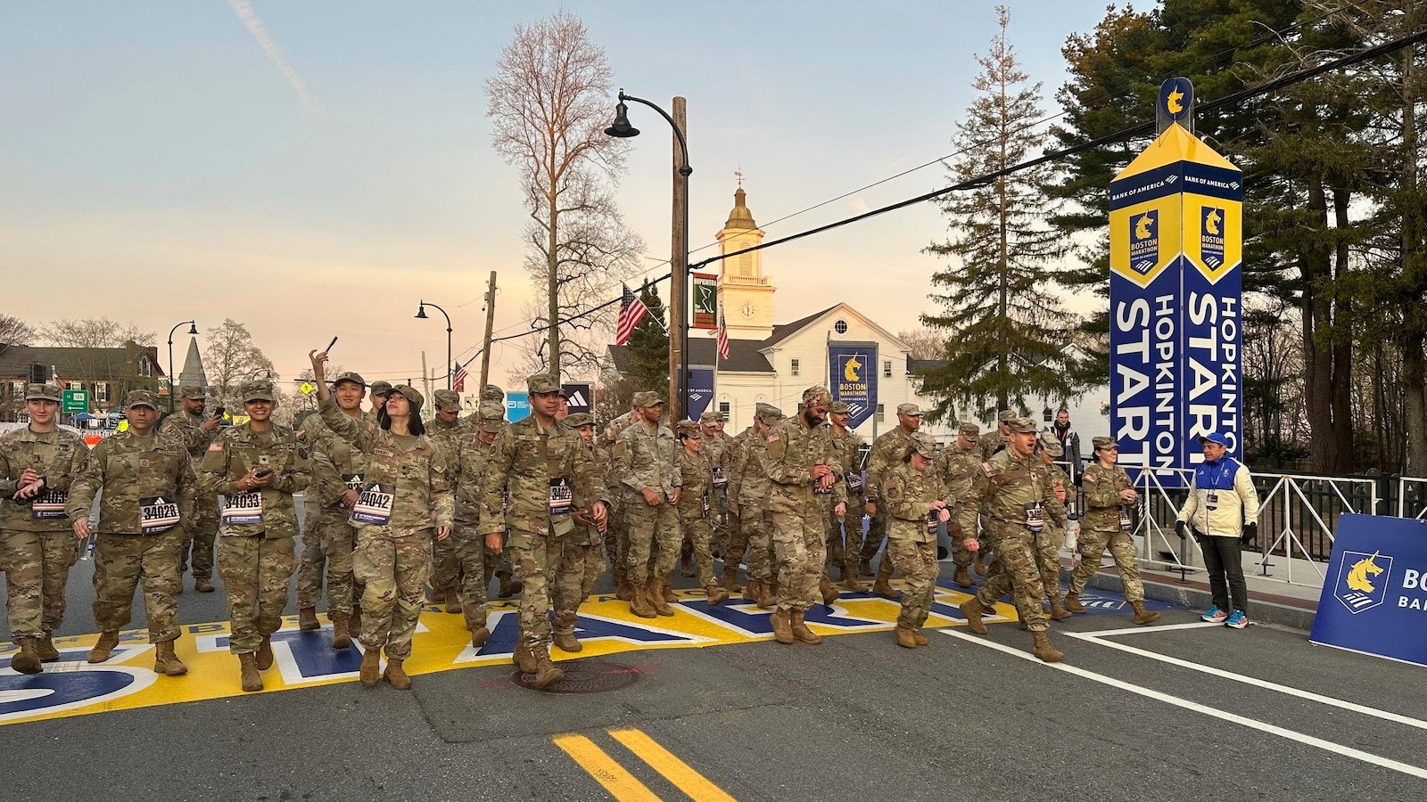 Military protesters left Hopkinton to start the 129th Boston Marathon