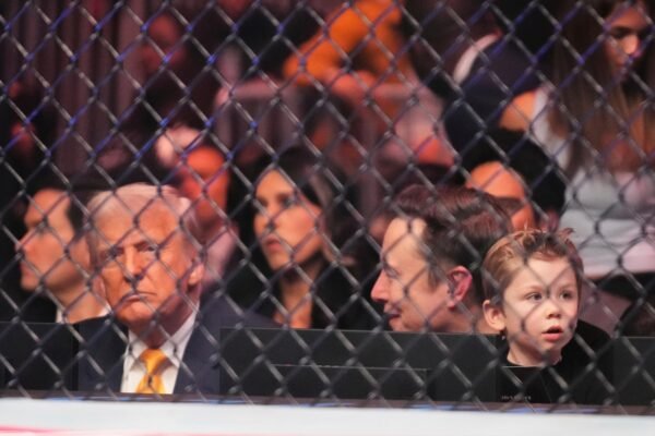 Trump receives ovation standing when he enters the UFC event in Miami