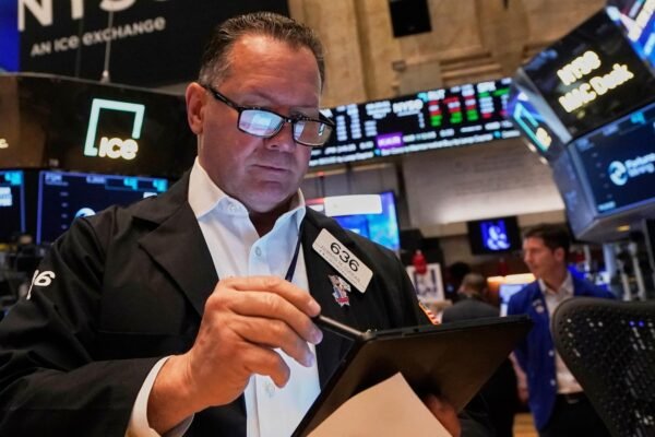 Asian actions work higher after Wall Street rises moderately, since the Fed has stable rates