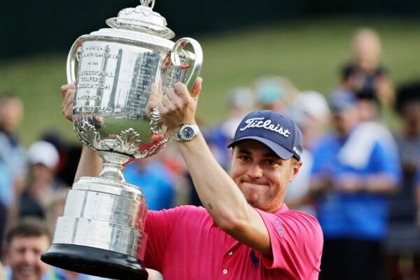 Don't drop it! The 27 -pound wanamaker trophy of the PGA championship can be a beast to raise