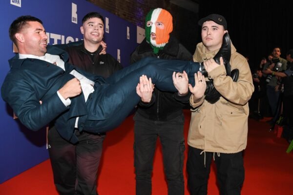 Member of the Irish Rap Trio Kneecap accused of a terrorist crime in the United Kingdom